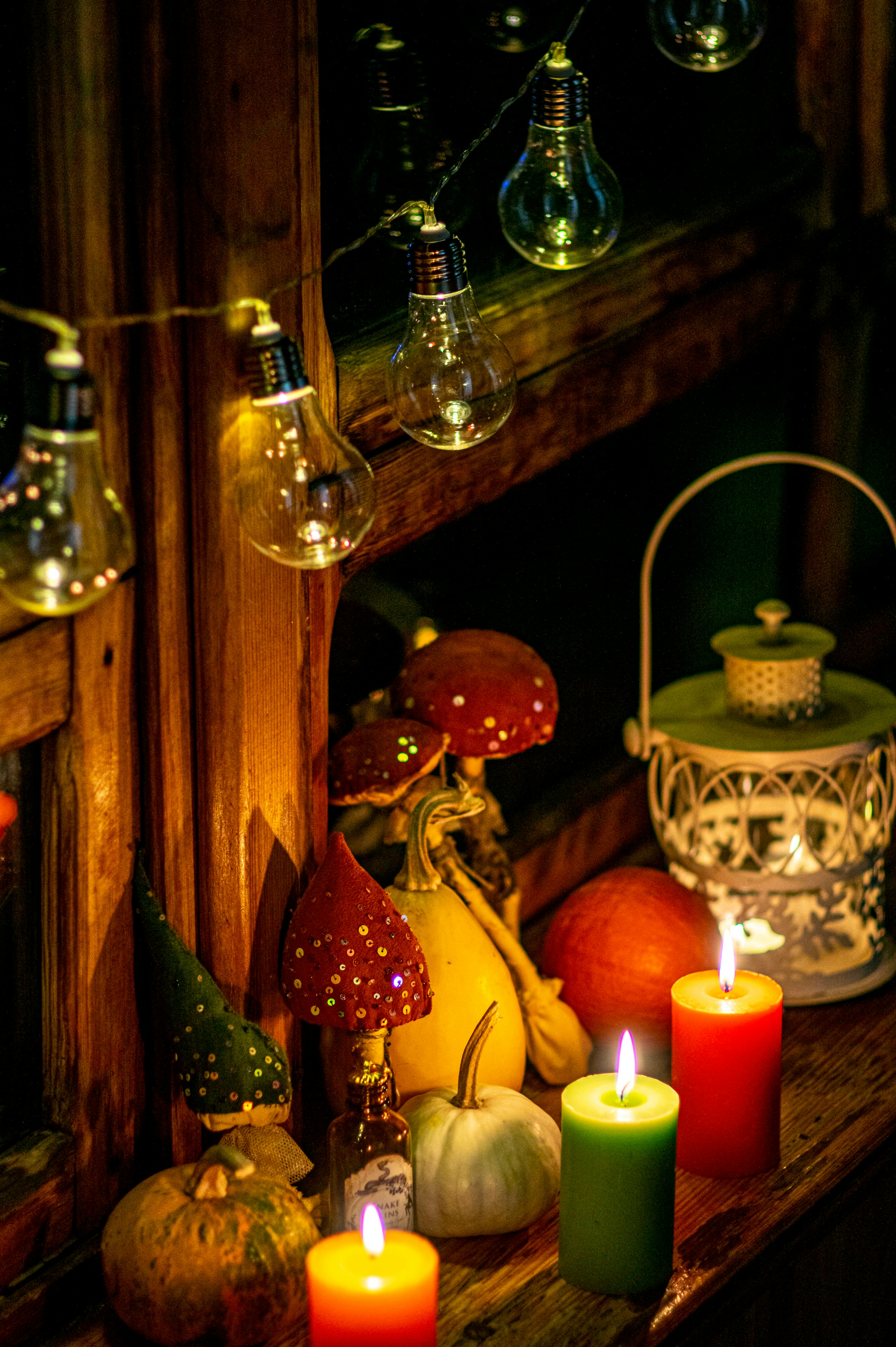 lighted candles on brown wooden candle holder